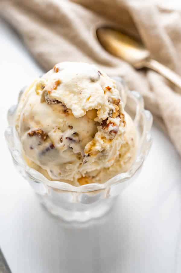 a dish of bourbon ice cream with a spoon.
