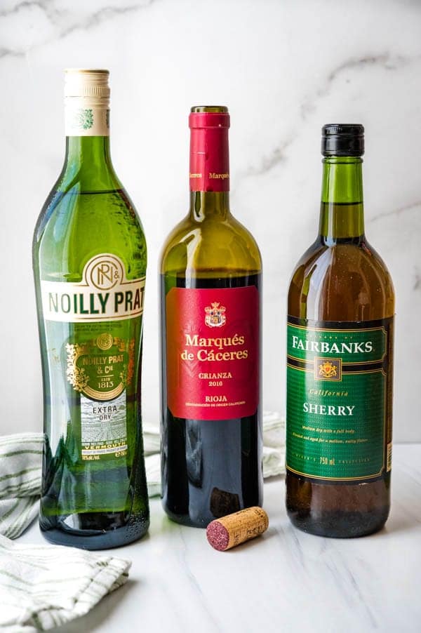 red wine or fortified wines will add flavor to plain jarred pasta sauce.