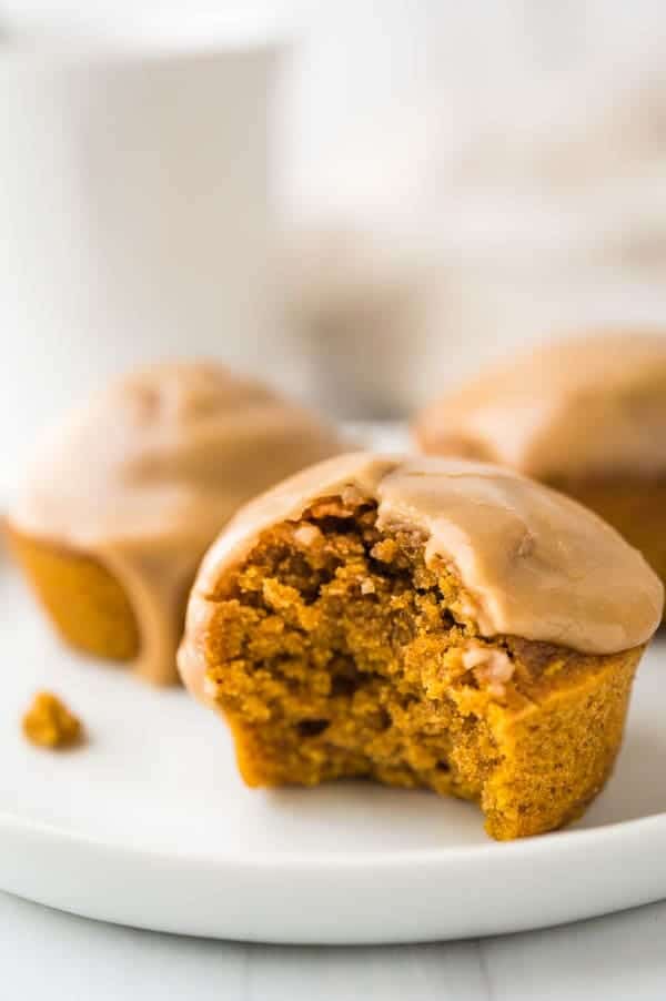Spiced maple pumpkin muffin with a bite taken out of it.