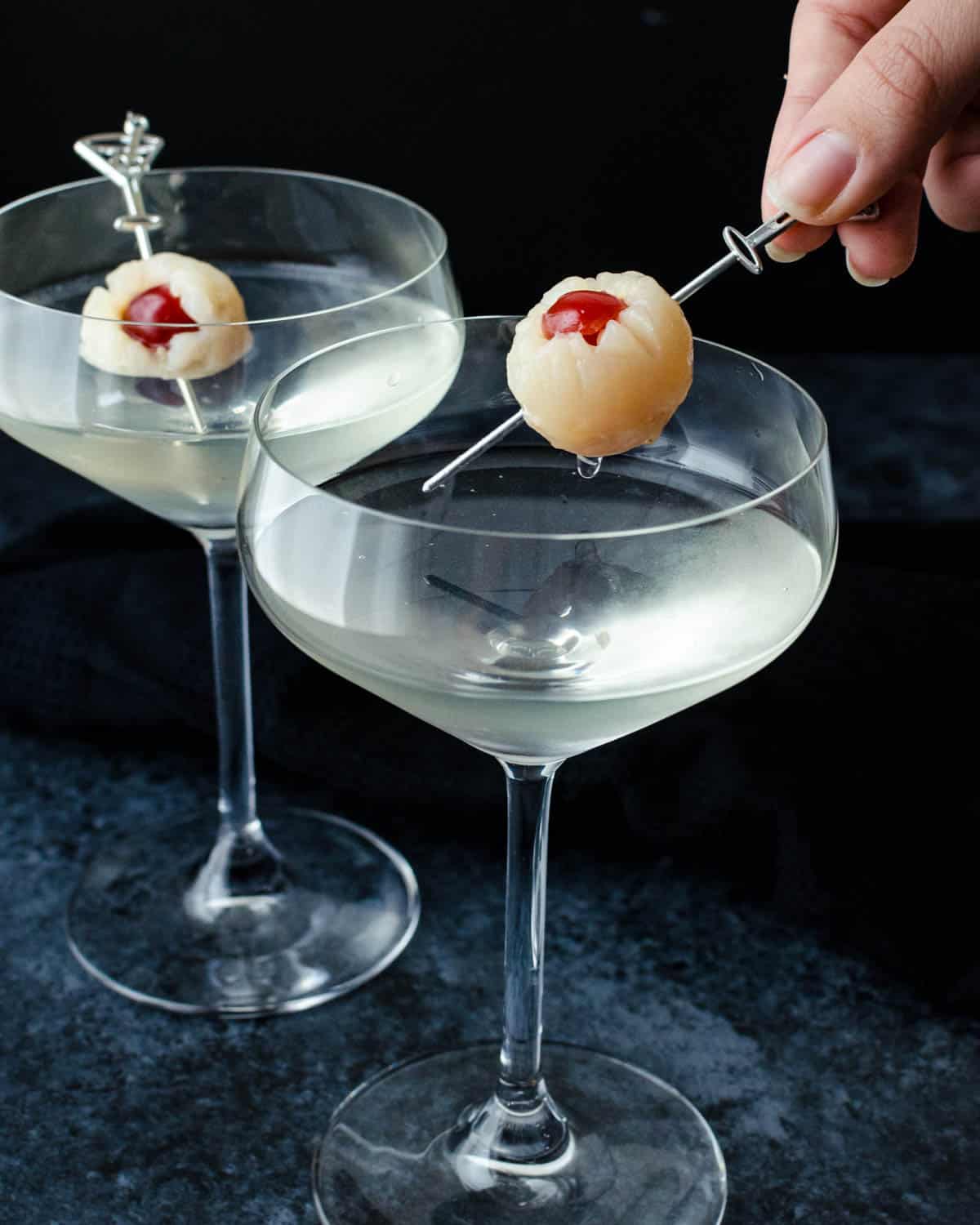 A lychee martini with a spooky cherry stuffed lychee eyeball.