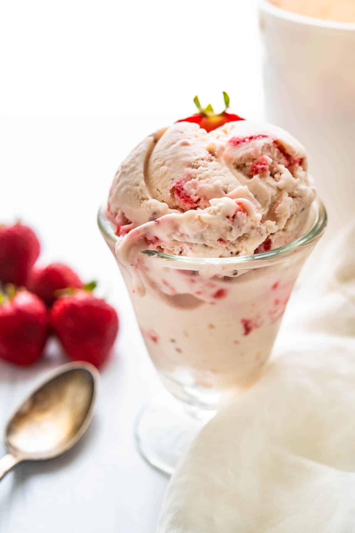 Serving a dish of strawberry ice cream.