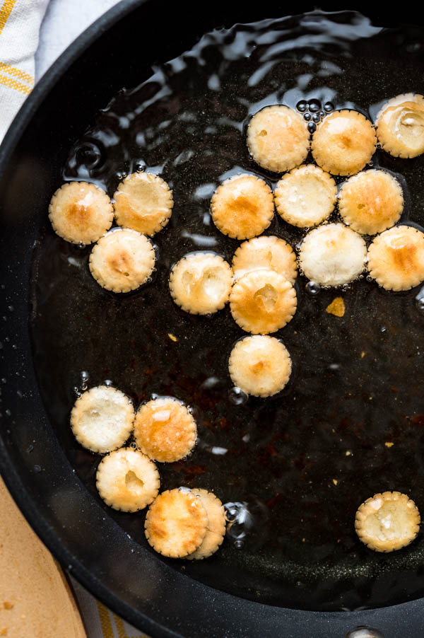 frying crackers in oil in a shallow skillet.