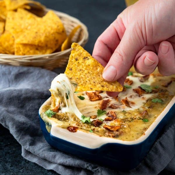 Hatch Chile Dip with a tortilla chip.