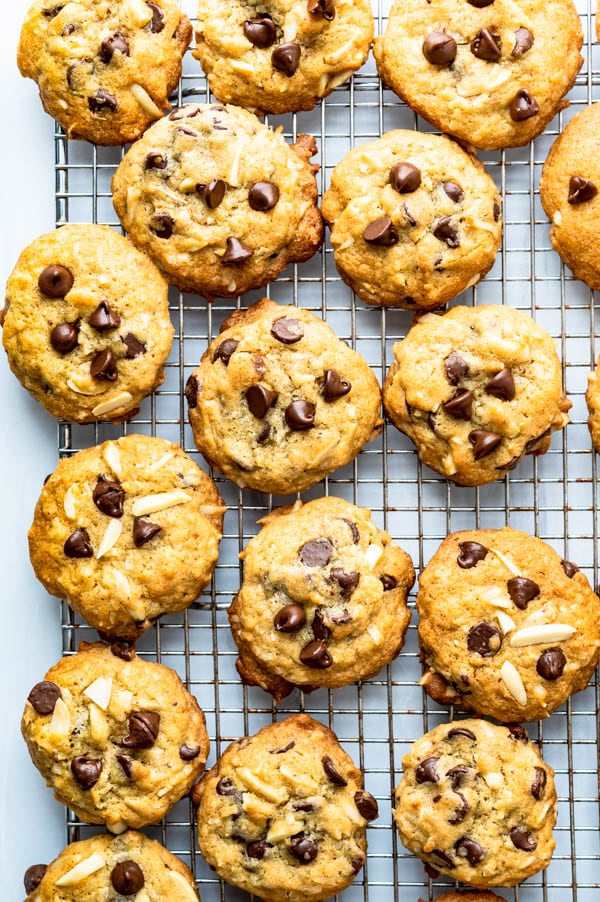 cooling chocolate chip cookies with coconut and almond on a cooling rack.