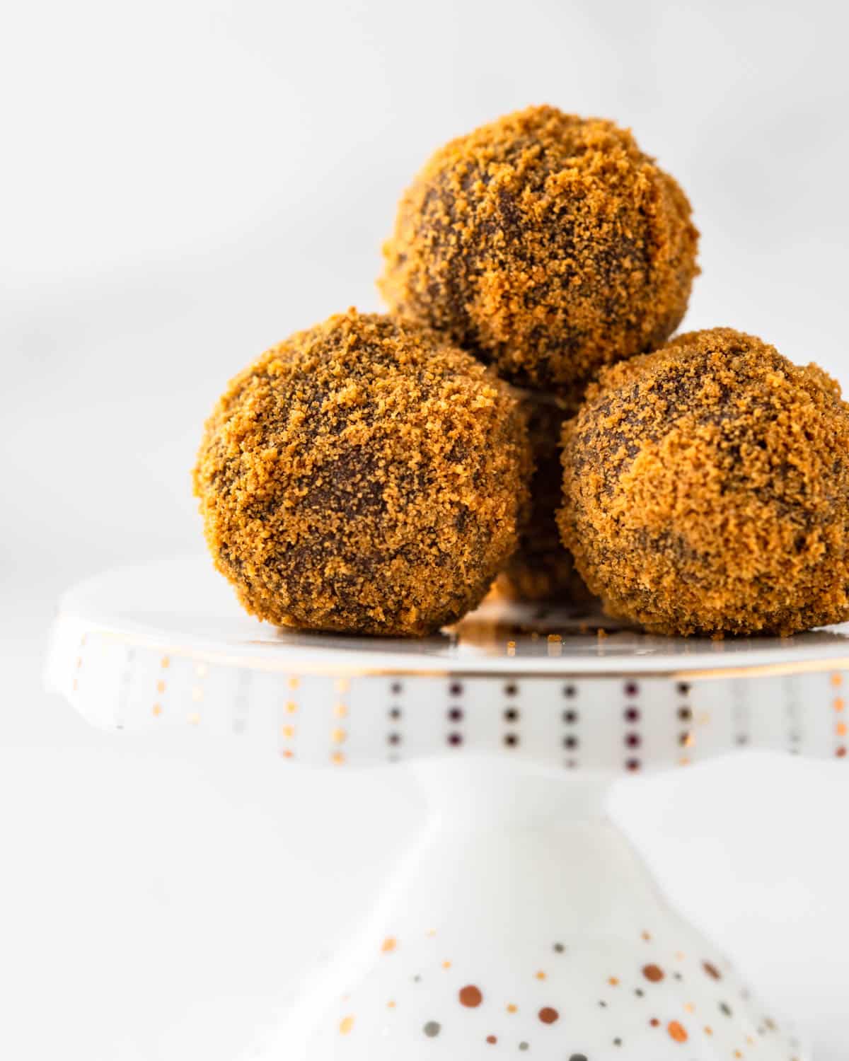 Chocolate Gingerbread truffles with bourbon on a pedestal.