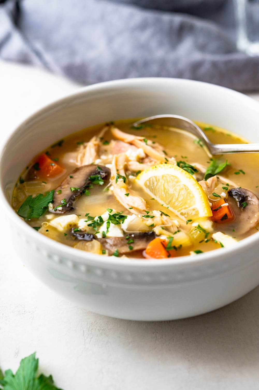 a bowl of greek chicken soup with leftover rotisserie chicken.