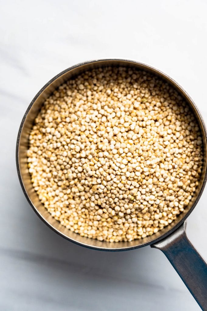 quinoa in a measuring cup.