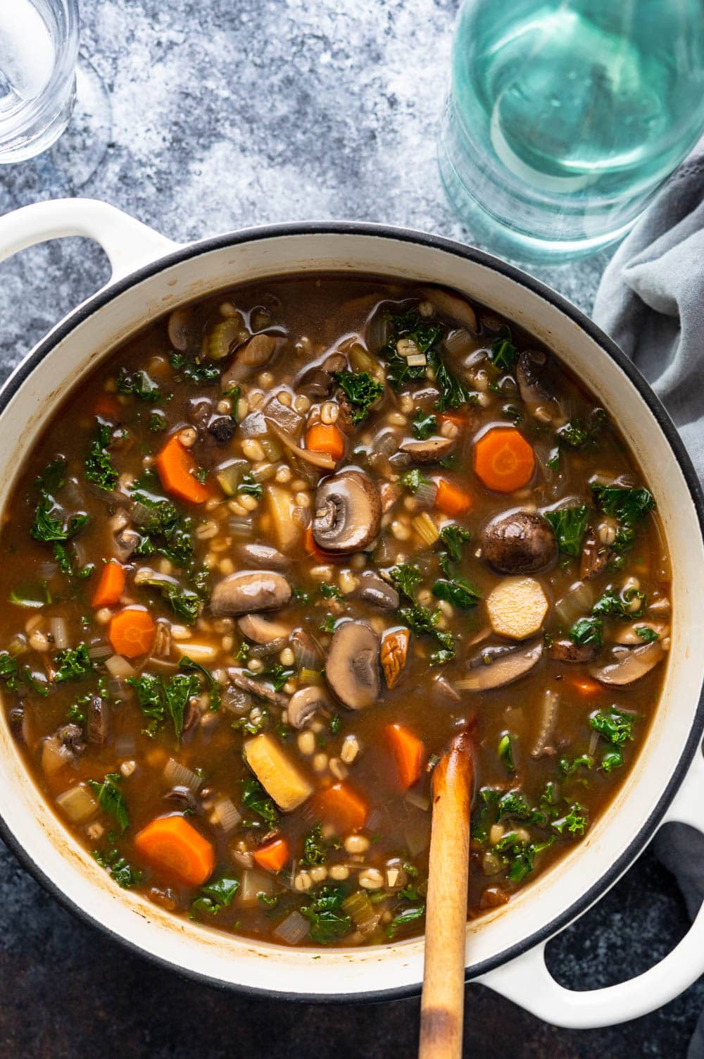 a pot of barley mushroom vegetable soup.
