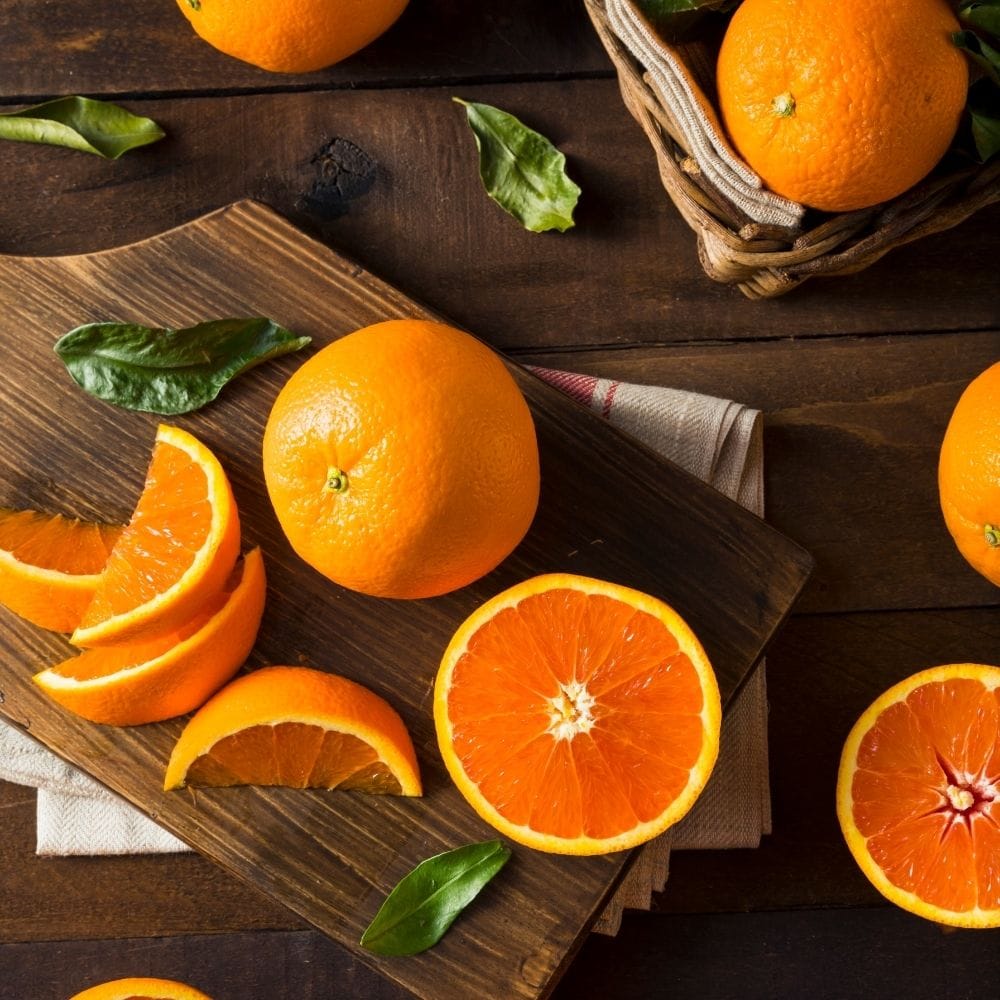 Cara cara oranges on a cutting board.