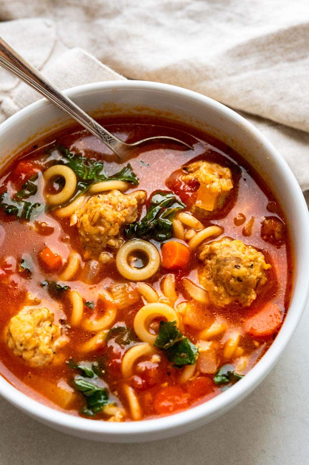 A bowl of Italian meatball soup.