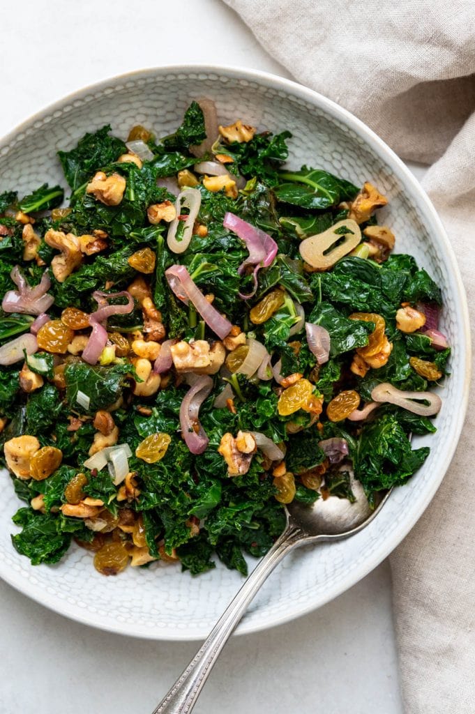 Blanched kale with walnuts and raisins.