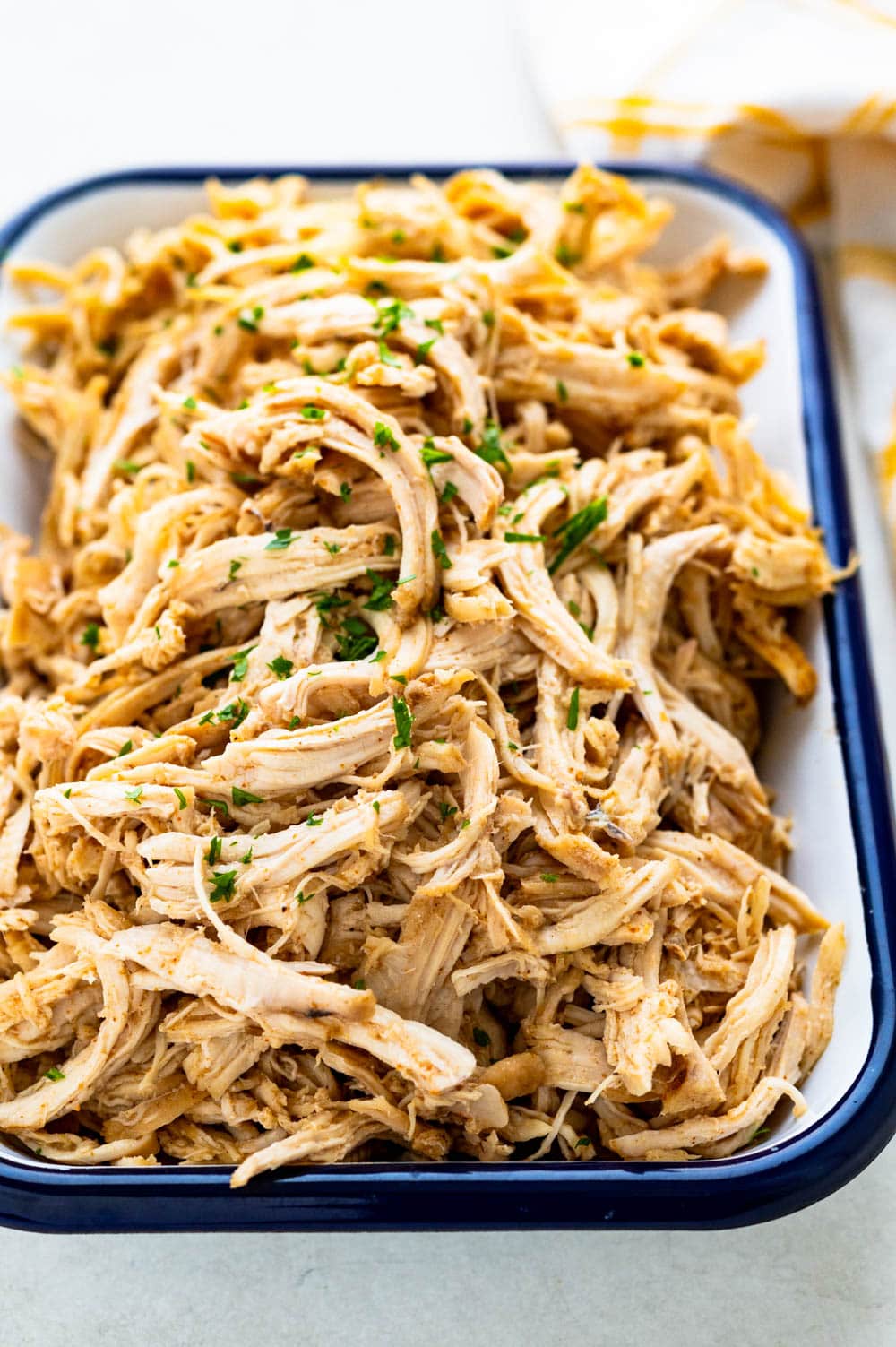 Pulled chicken in a serving dish.