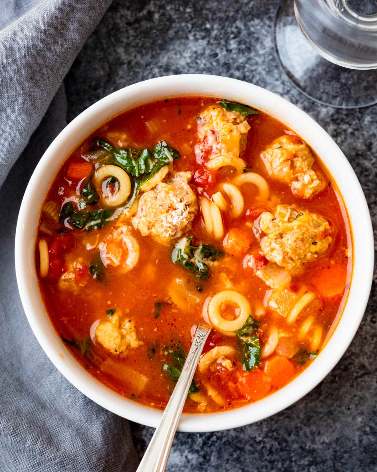 a bowl of italian meatball soup.