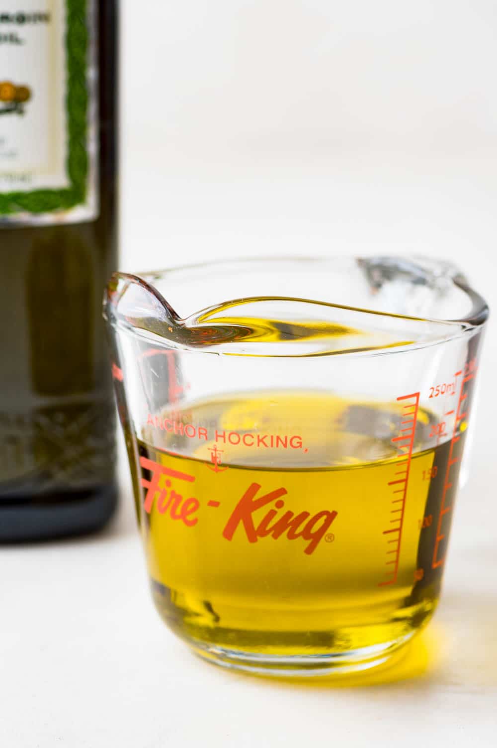 olive oil in a measuring cup.
