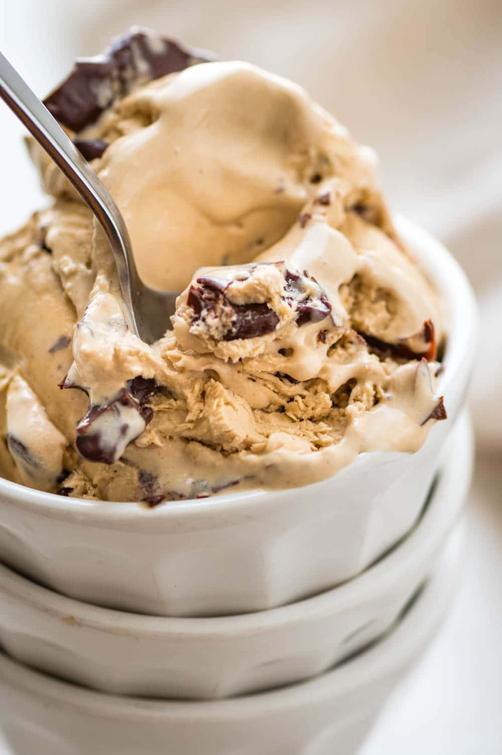 a bowl of espresso ice cream with dark chocolate magic shell.