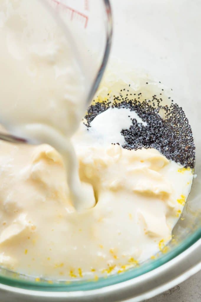 adding buttermilk and mayonnaise to the bowl.