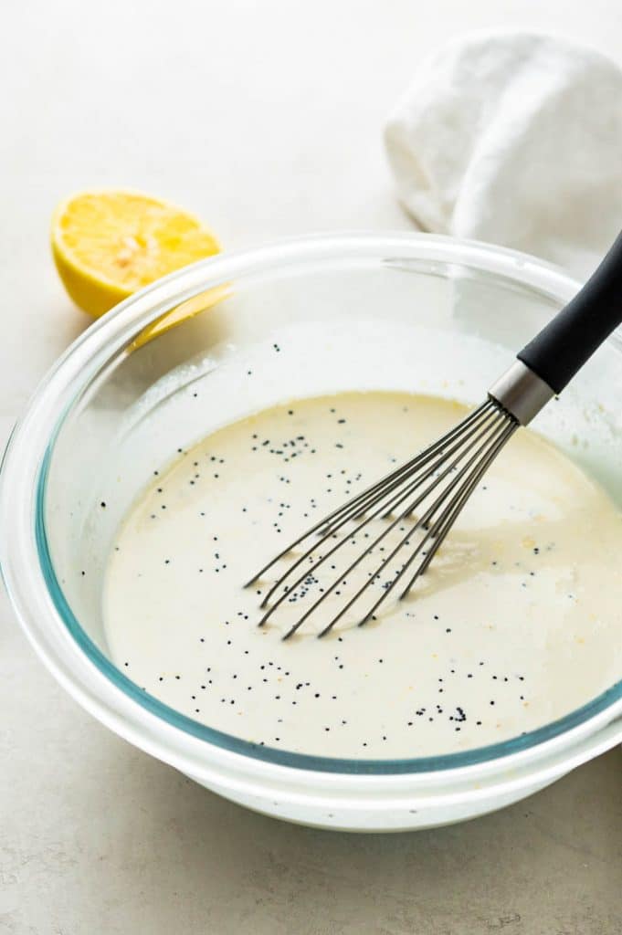 whisking the lemon, poppy seed and buttermilk mixture together.