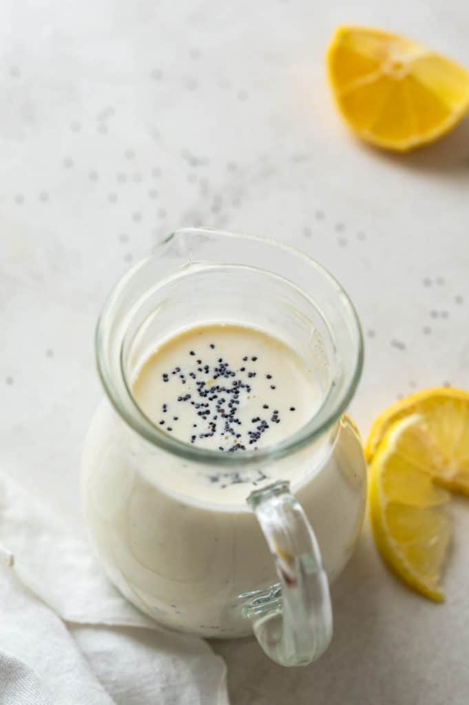 a pitcher of lemon Poppy Seed Dressing.