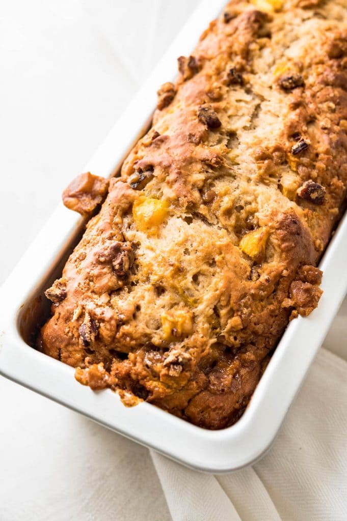 A baked loaf of praline peach bread.