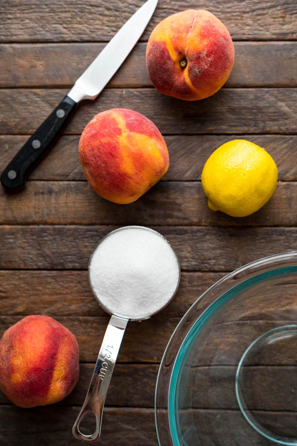 Fresh peaches, sugar and lemon to make the peach simple syrup.