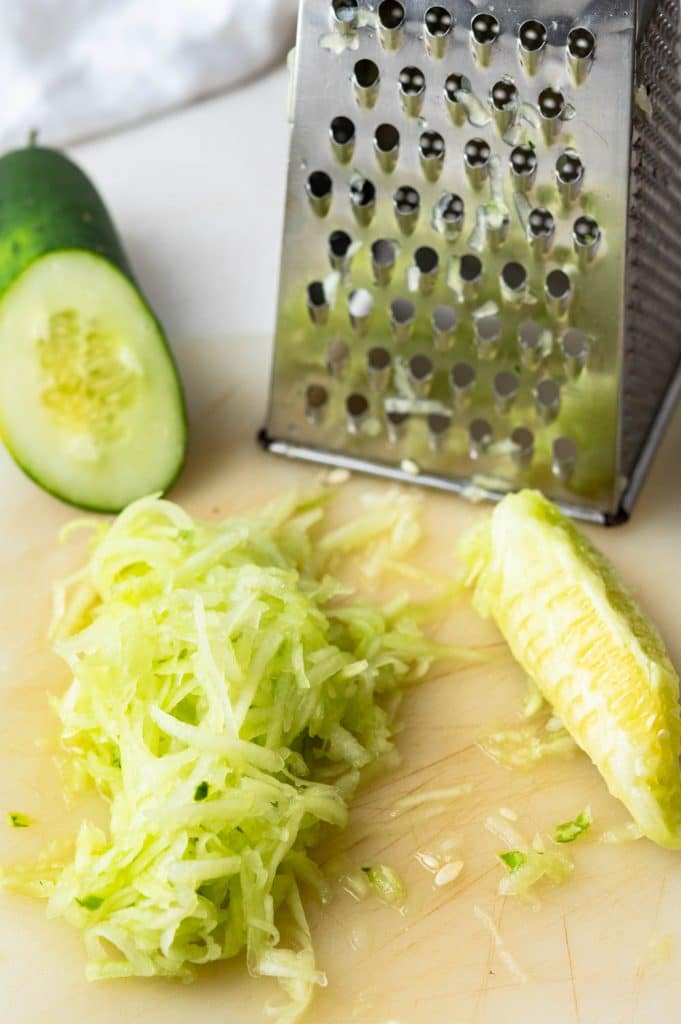 grating the cucumber.