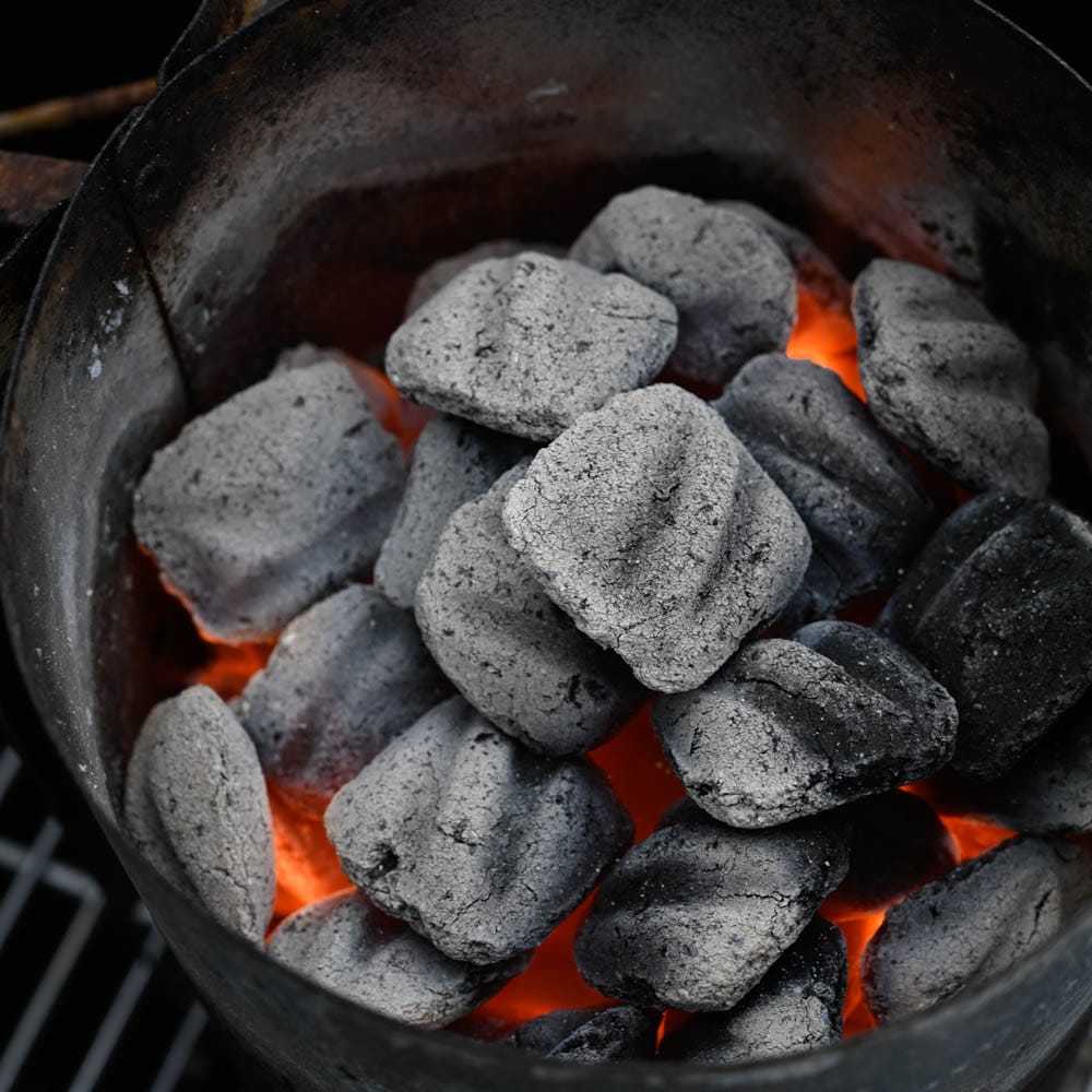 charcoal grill and hot embers to cook rack of lamb over.