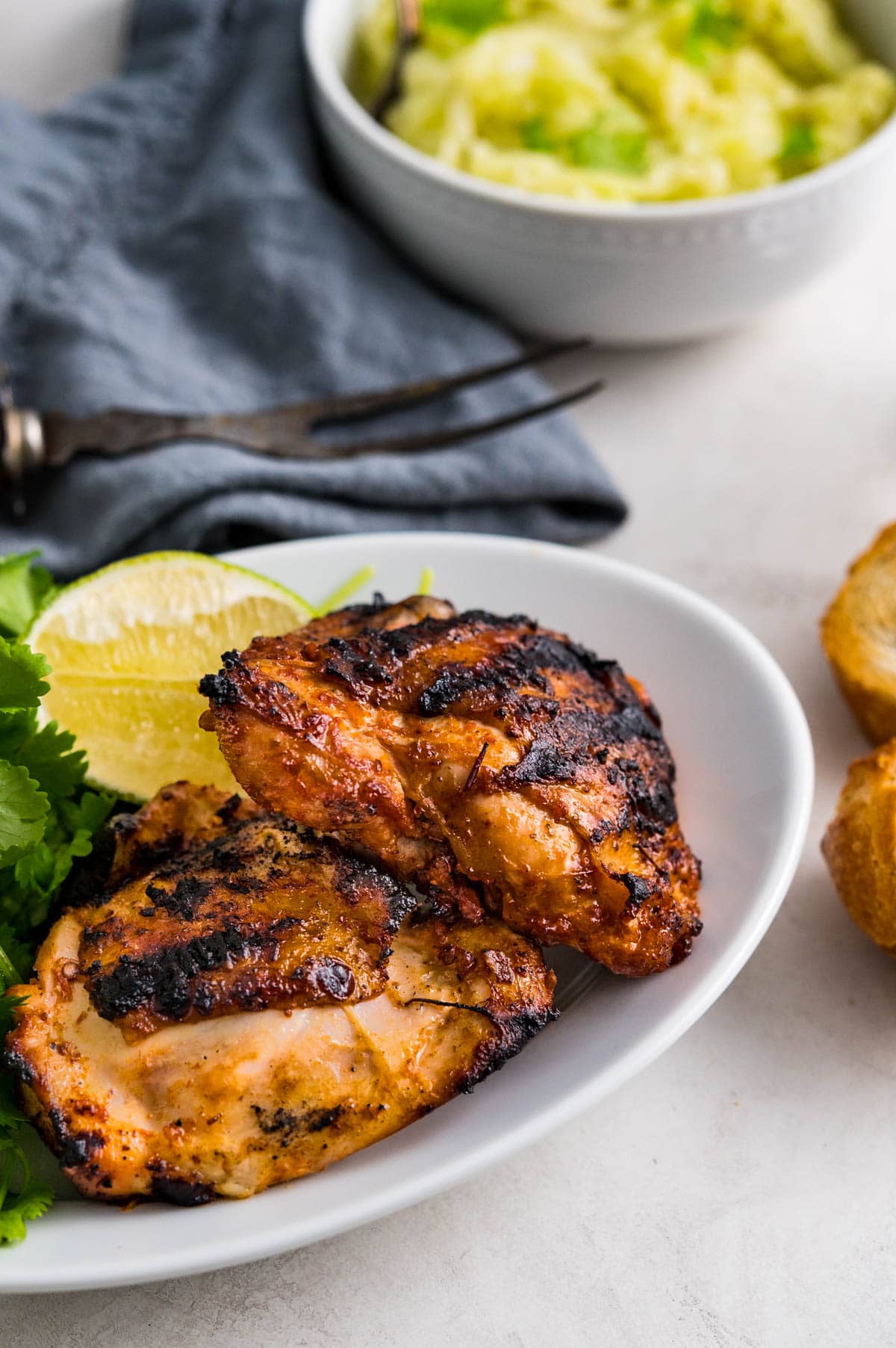 grilled chipotle chicken thighs on a plate. 