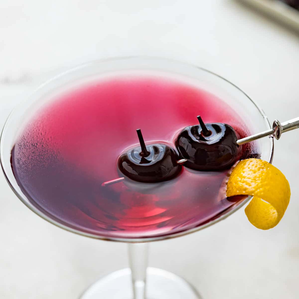 cherry martini in a martini glass.
