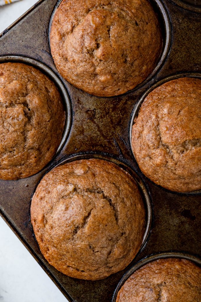 baked applesauce muffins in the tin.