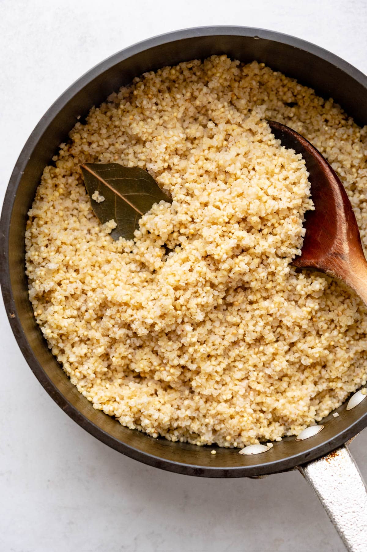 Fluffed, cooked millet in a pan.