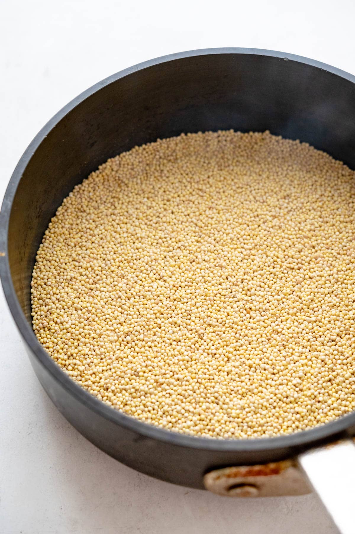 heating millet in a heavy pan to toast the seeds. 