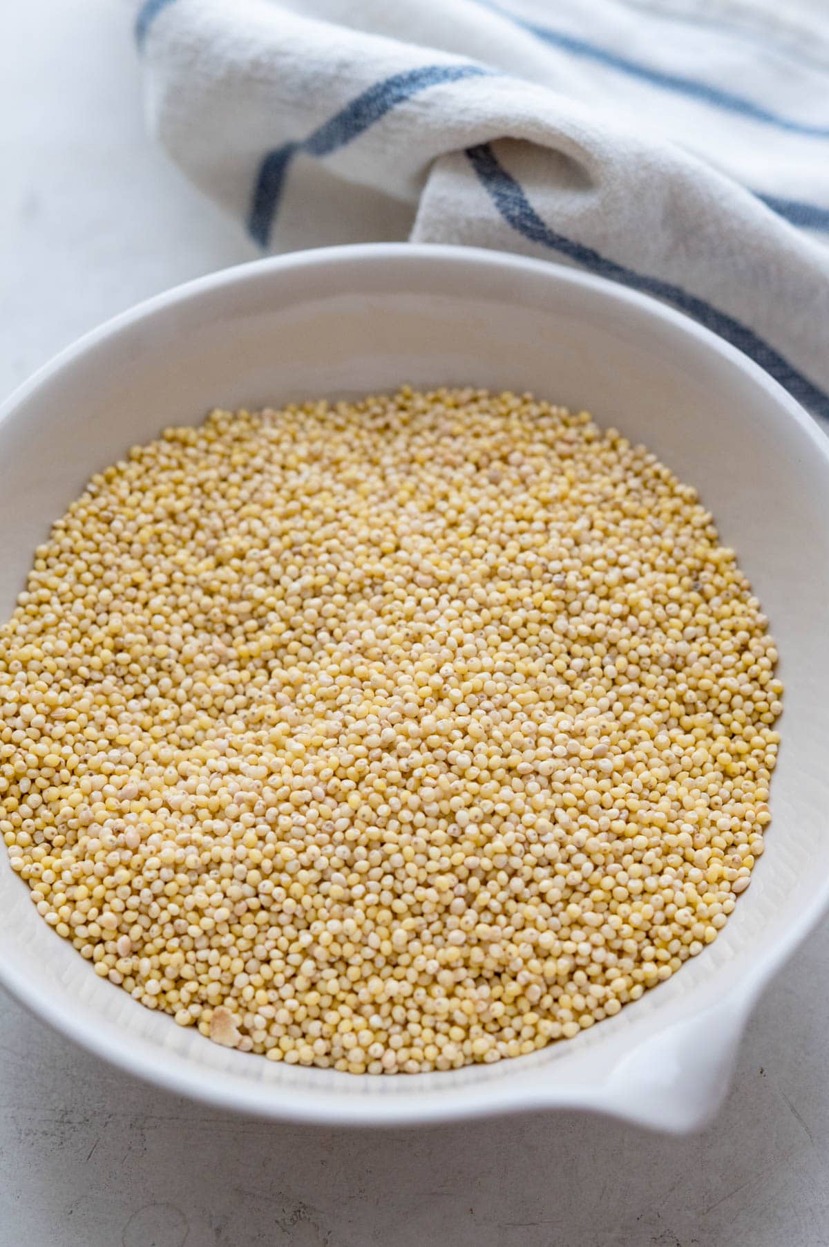 hulled millet seeds in a dish. 
