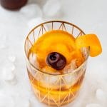 holiday old fashioned in a rocks glass with garnish.