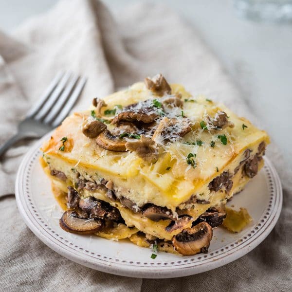 a serving of mushroom lasagna on a plate.