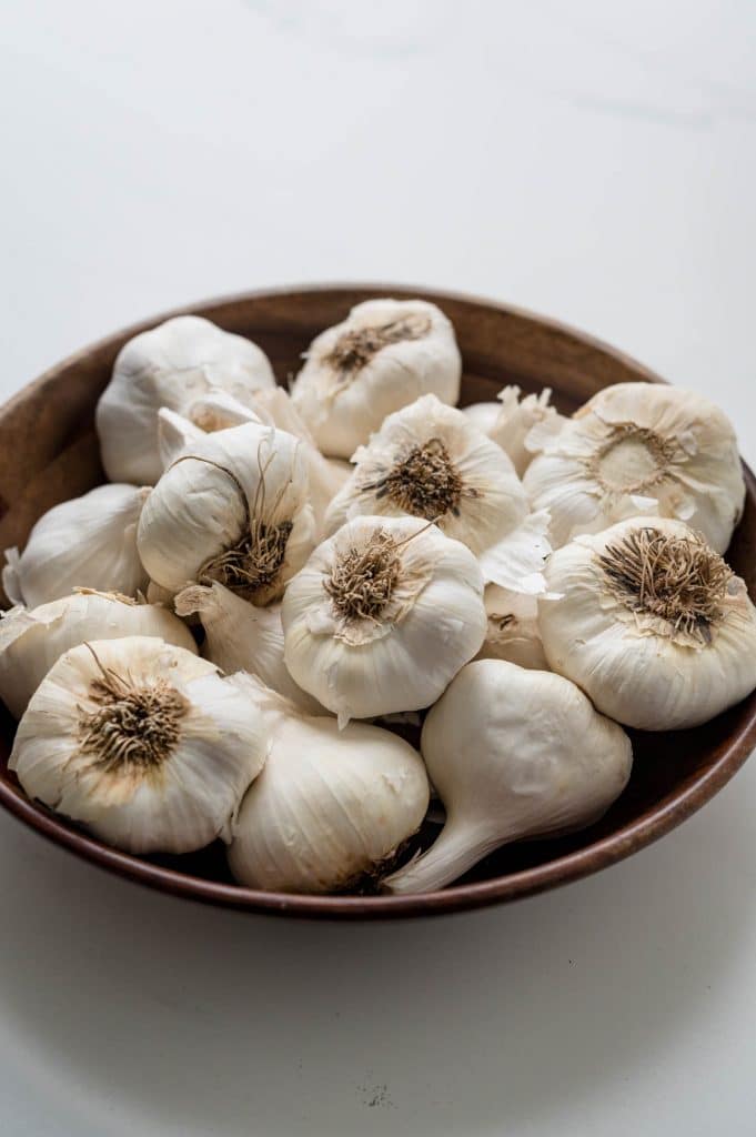 a bowl of garlic bulbs. 