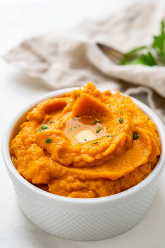 a serving bowl of whipped sweet potatoes. 