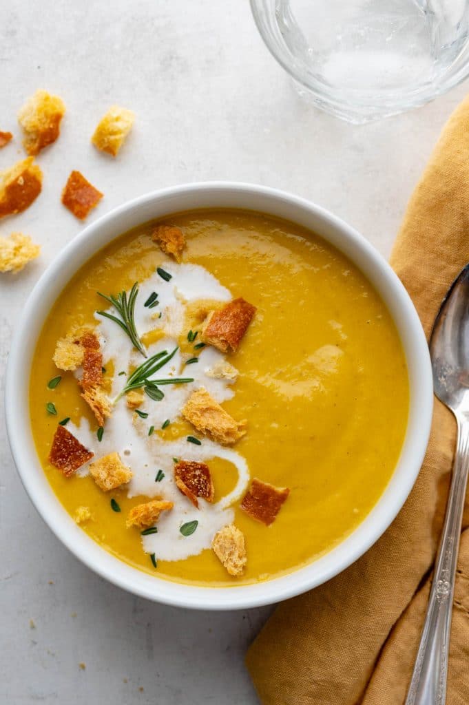 roasted vegetable soup with croutons and cream. 