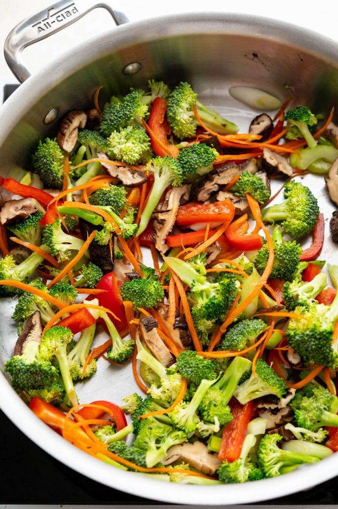 stir frying the broccoli and vegetables in a hot skillet. 