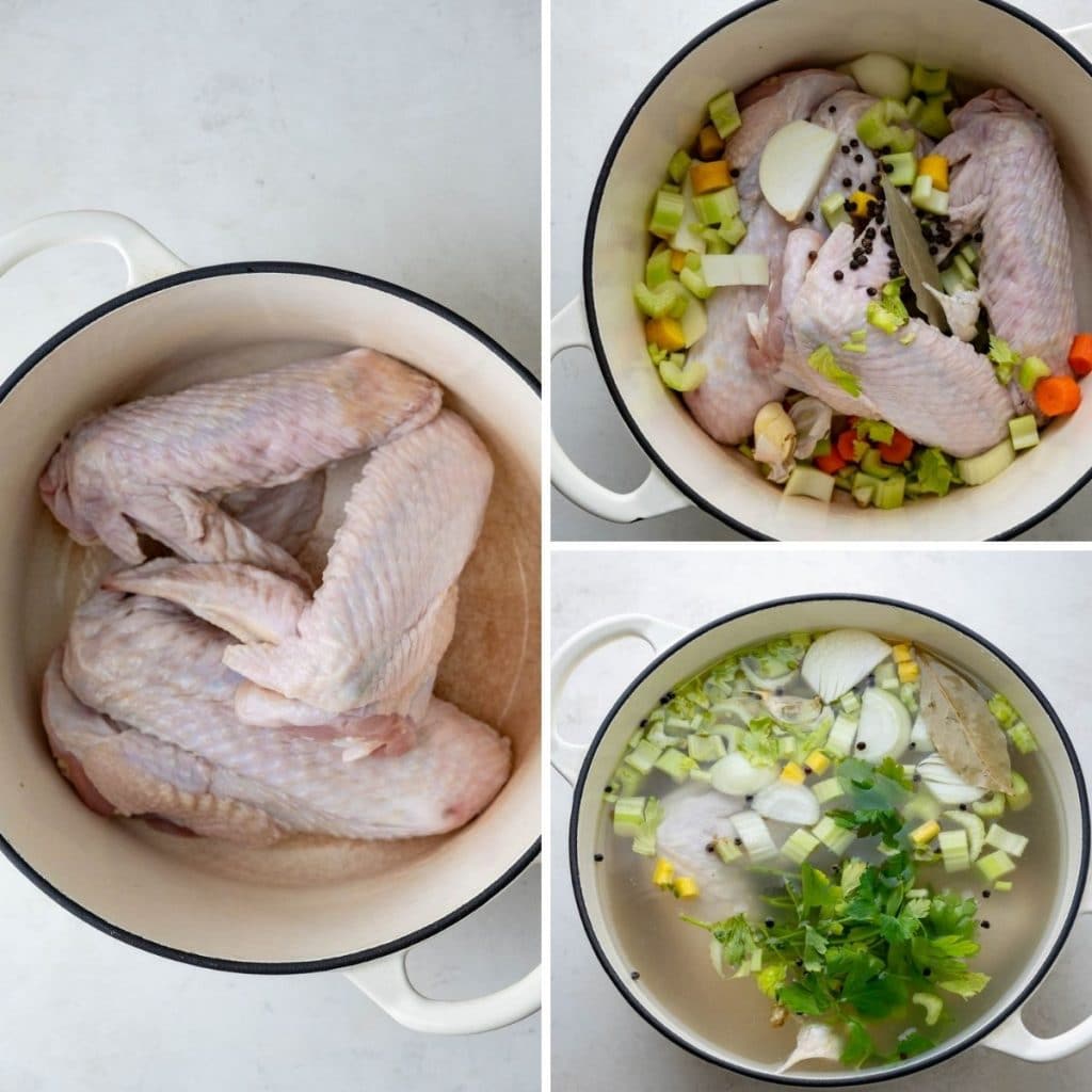 Adding turkey wings to a stock pot with veggies and herbs. 