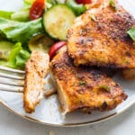 baked chicken thighs with a salad.