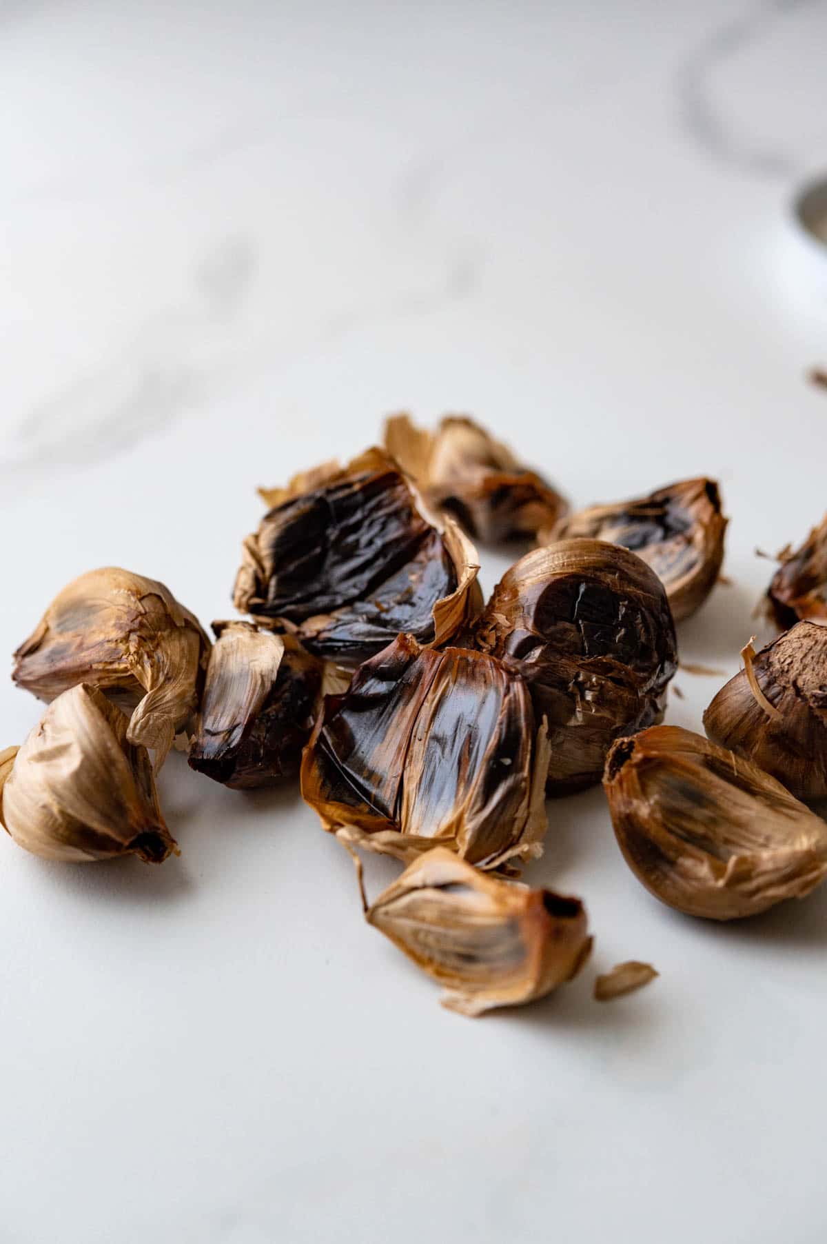 individual cloves of black garlic.