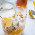 pouring milk over muesli.
