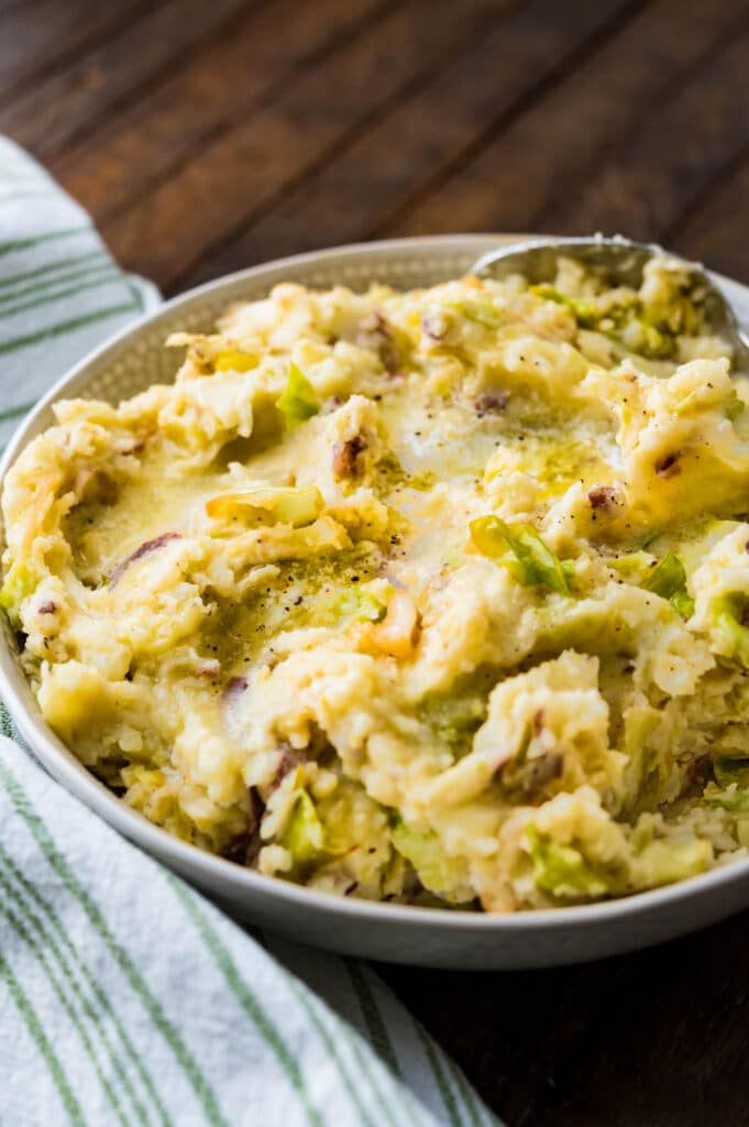 Irish cabbage and potatoes with a pool of melted butter. 