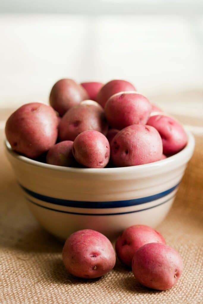a bowl of red potatoes.