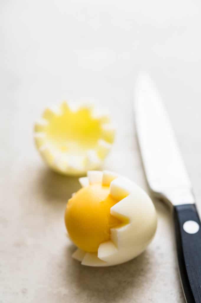 Creating a Van Dyke cut for hard boiled eggs.