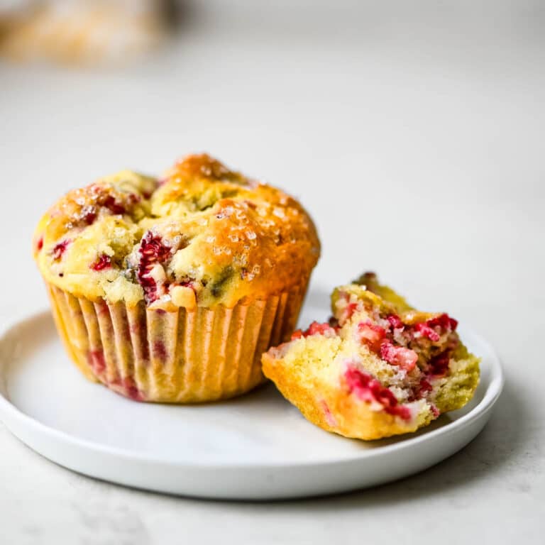 raspberry muffins on a plate.