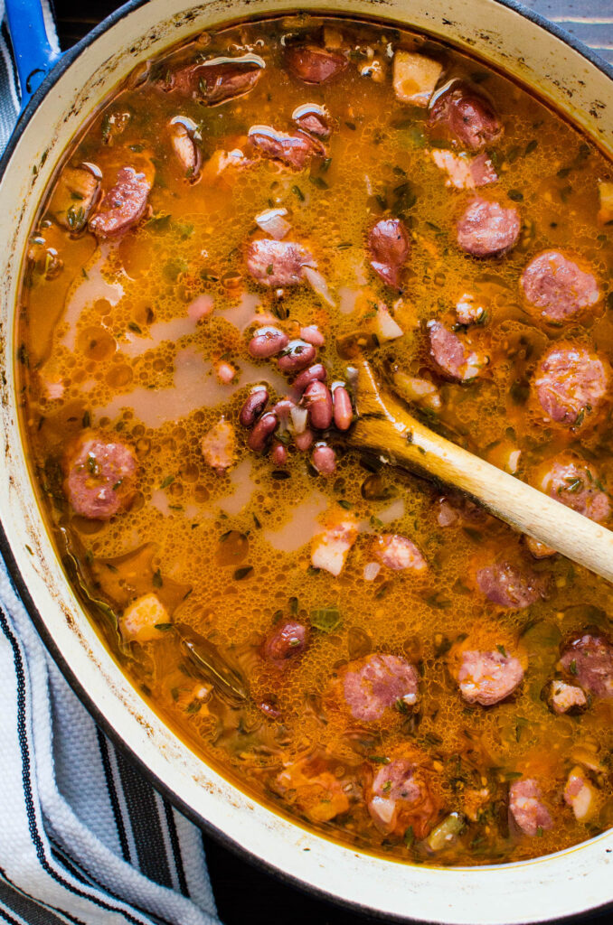 a pot of red bean soup with andouille sausage. 