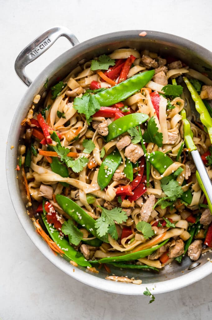 Use a wok if you have one, otherwise a large, heavy skillet works well for making pork lo mein.