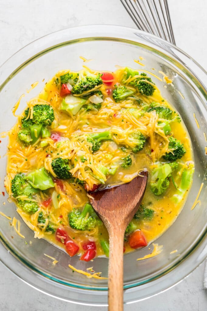 Mix the broccoli and veggies with the egg and cheese.