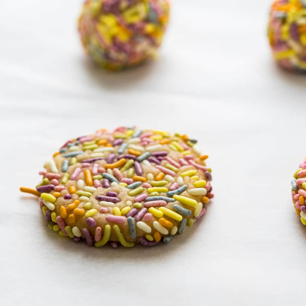 lemon sugar cookies coated in pastel jimmy sprinkles.